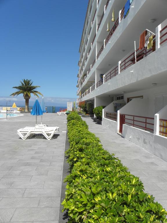 A balcony or terrace at First Line Beach Apartment with Ocean View La Arena