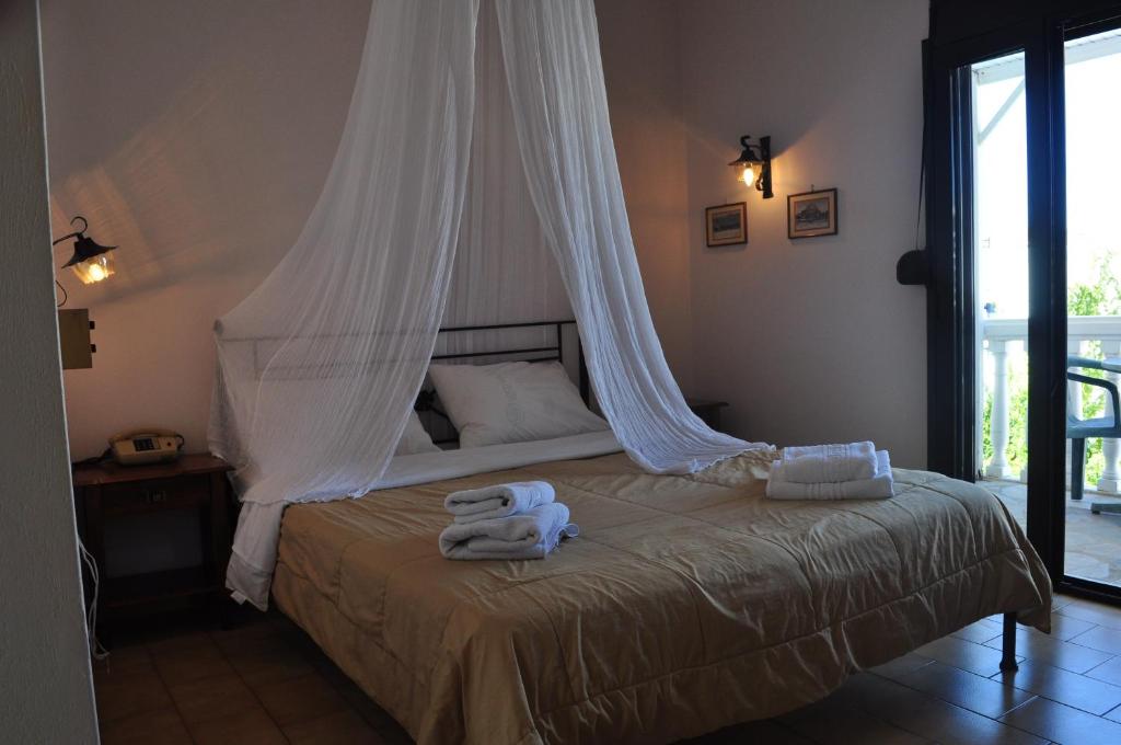 Postel nebo postele na pokoji v ubytování Byzance Hotel