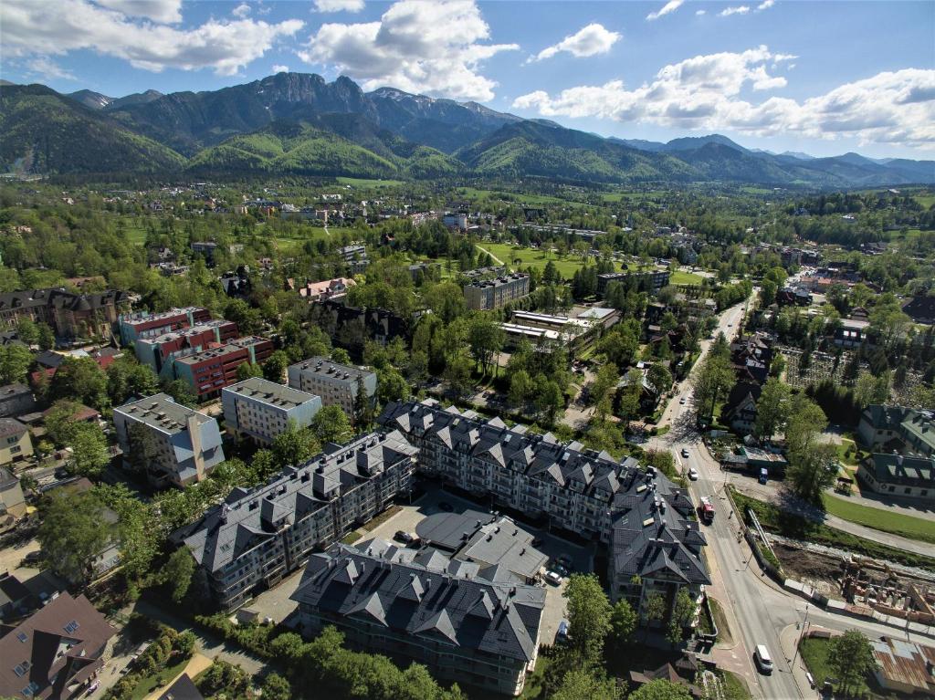 an aerial view of a city with mountains in the background at Lux apartamenty Stara Polana in Zakopane