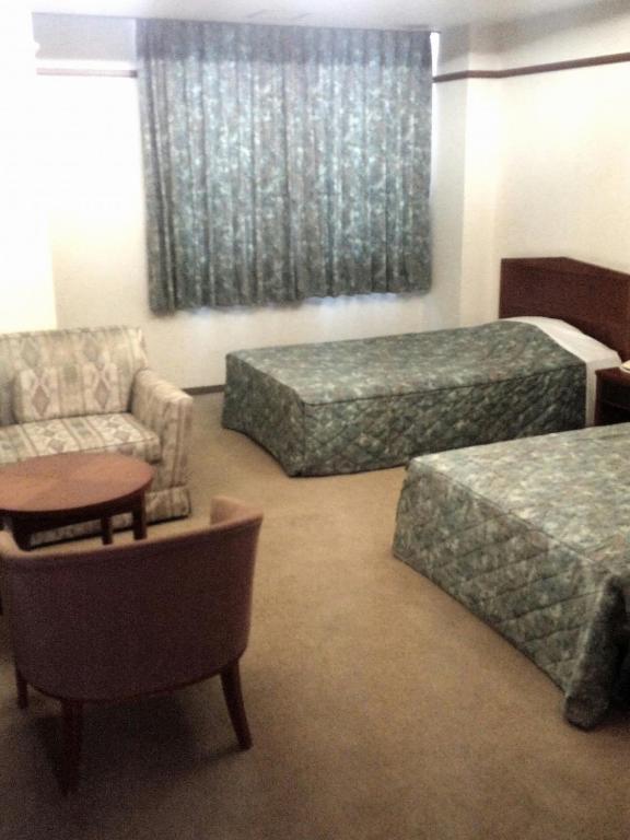 Postel nebo postele na pokoji v ubytování Hotel Danrokan