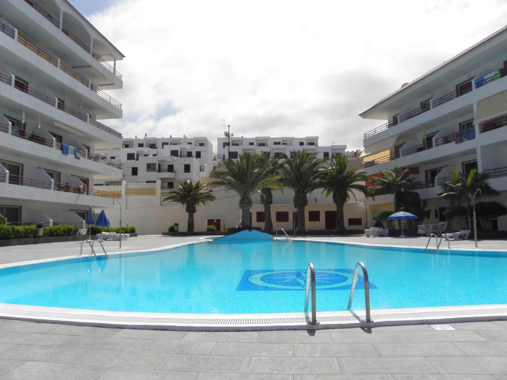 The swimming pool at or close to First Line Beach Apartment with Ocean View La Arena