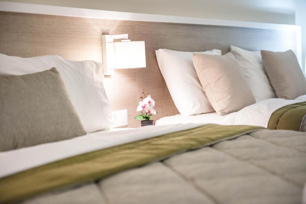 Postel nebo postele na pokoji v ubytování Hotel Vizantio