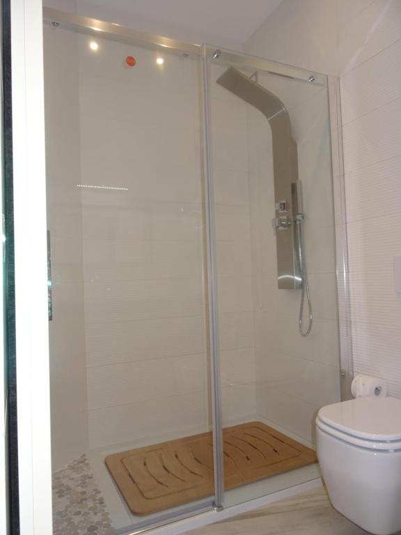 a shower stall in a bathroom with a toilet at Suites Margot in Santa Margherita Ligure