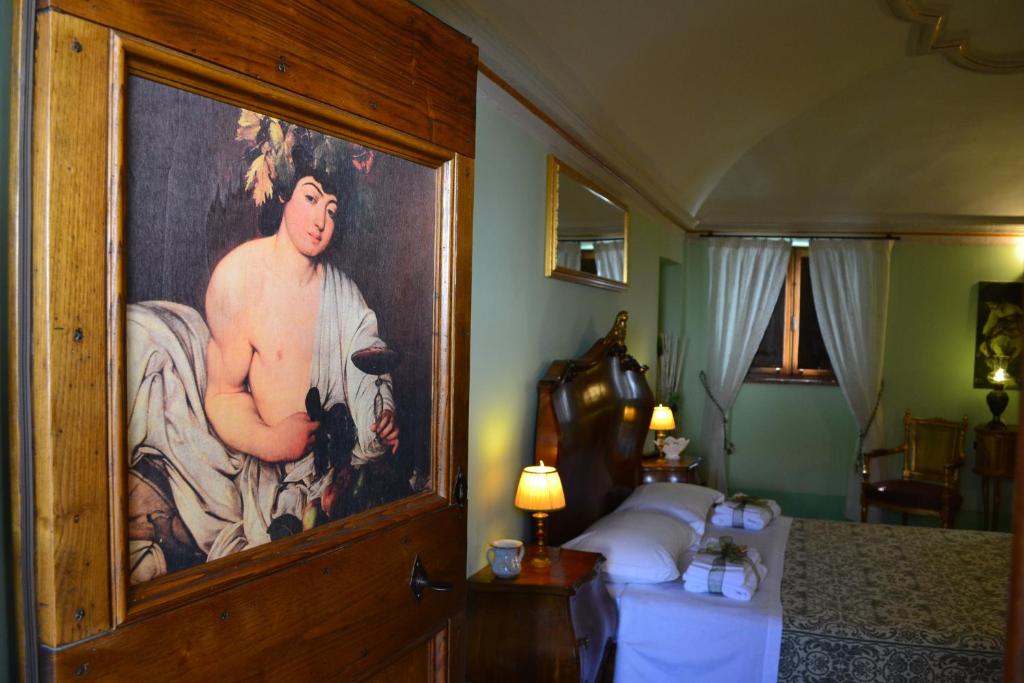 Postel nebo postele na pokoji v ubytování B&B Palazzo La Loggia