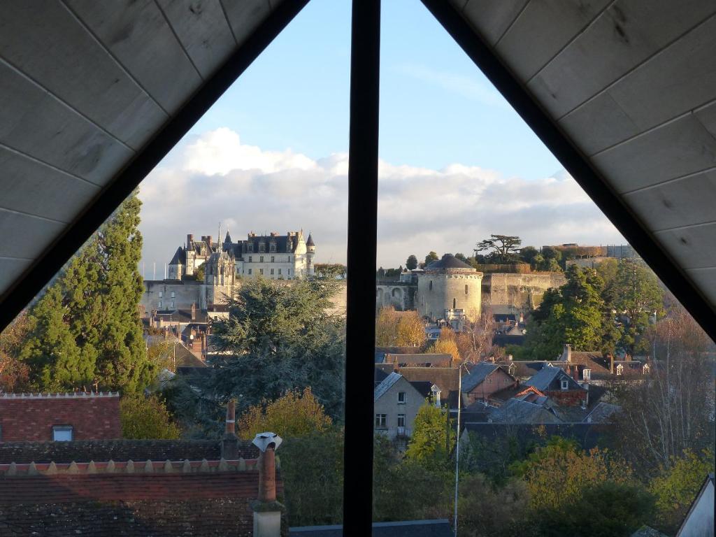 a view of a city from a window at Le Point De Vue De Leonard in Amboise