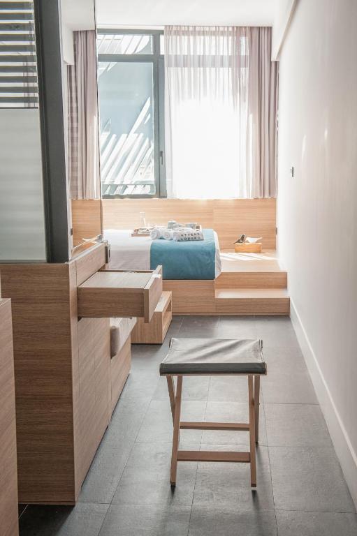 Postel nebo postele na pokoji v ubytování Athens Lodge by Athens Prime Hotels