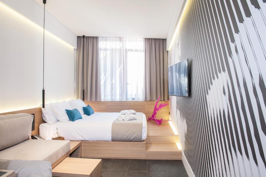 Postel nebo postele na pokoji v ubytování Athens Lodge by Athens Prime Hotels