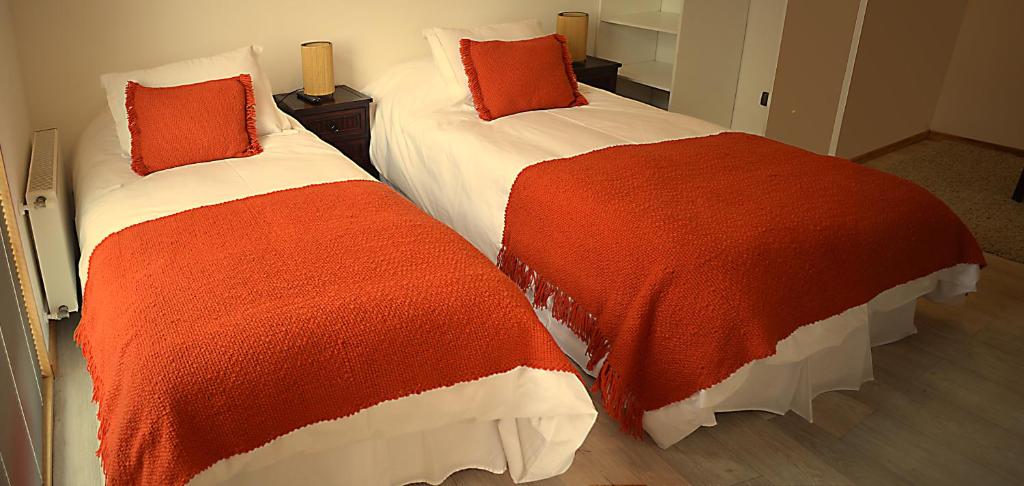 Postel nebo postele na pokoji v ubytování Apart Hotel Quillango