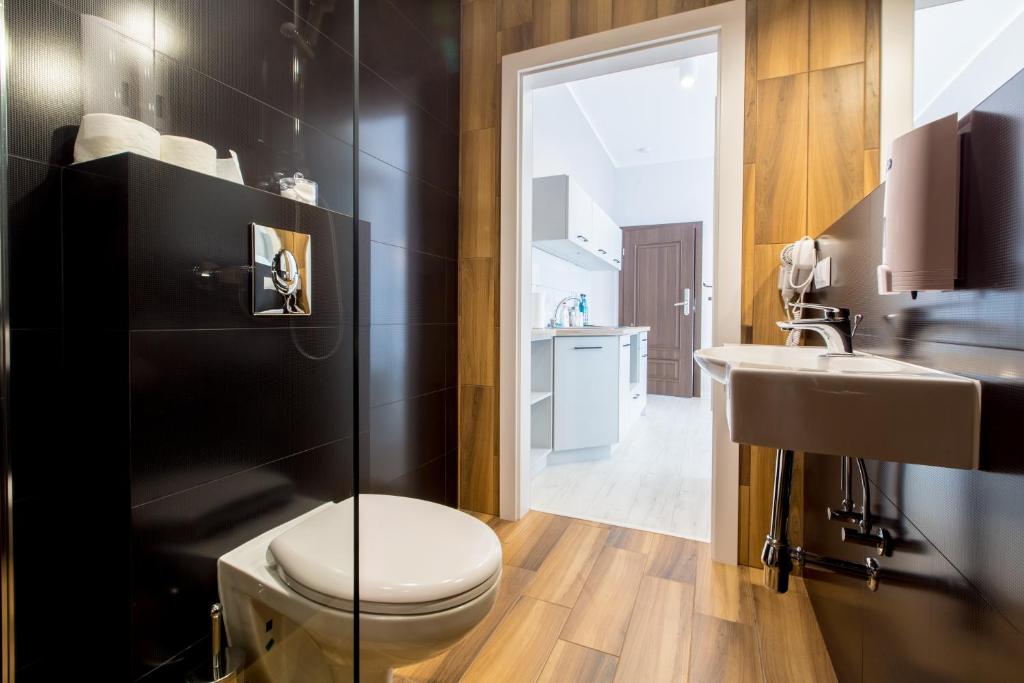 Koupelna v ubytování Apartamenty City.