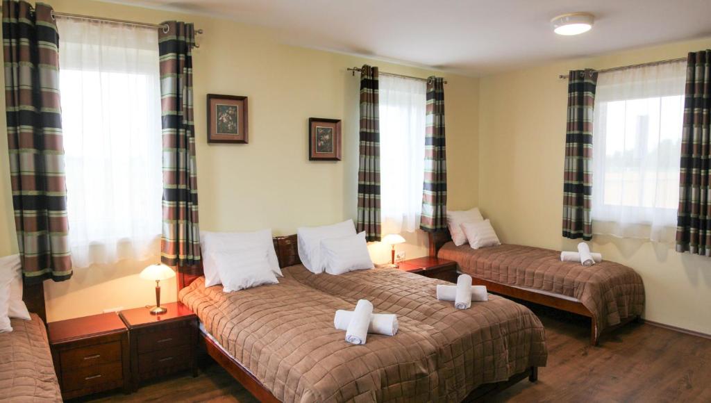 Ein Bett oder Betten in einem Zimmer der Unterkunft Szent János Vendégház