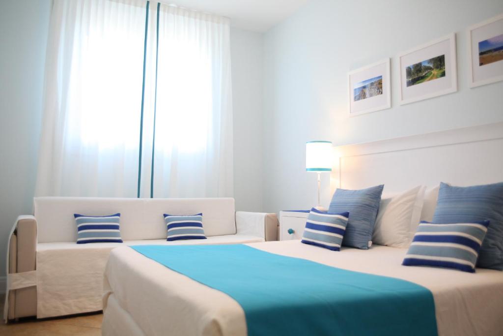 Postel nebo postele na pokoji v ubytování Terra d'Acqua Resort & SPA