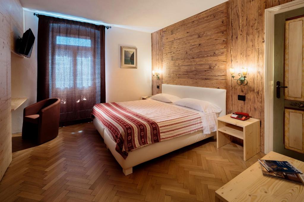 Postel nebo postele na pokoji v ubytování Hotel Corona