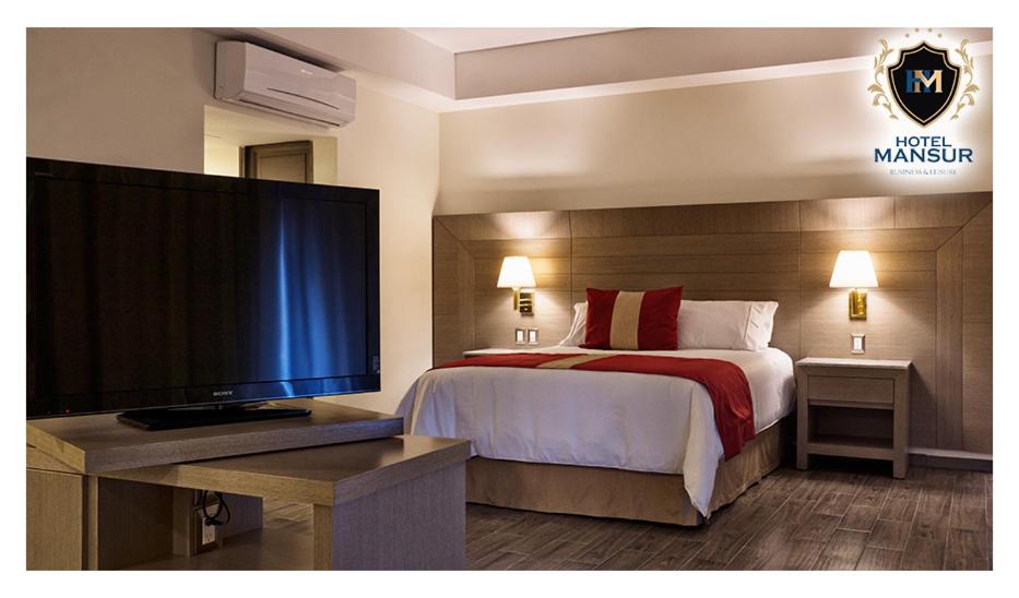 Postel nebo postele na pokoji v ubytování Hotel Mansur Business & Leisure