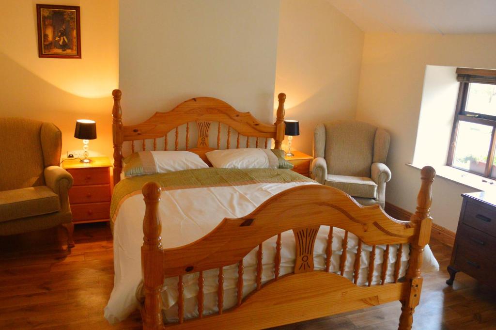 Postel nebo postele na pokoji v ubytování Biddys Cottage