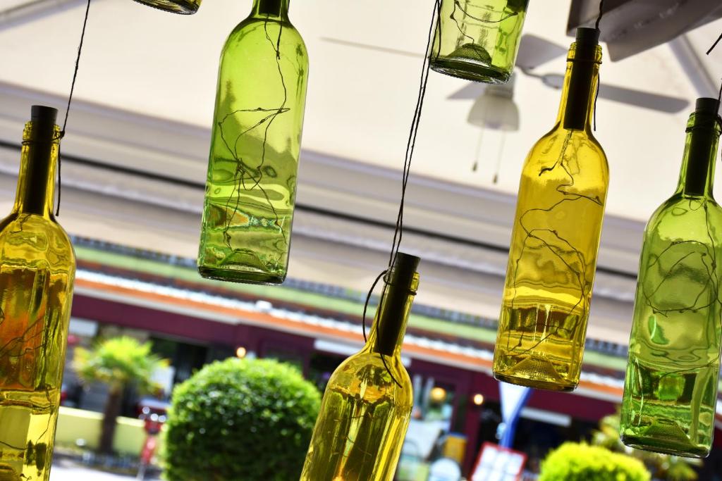 a group of glass bottles hanging from a ceiling at Hotel Ristorante Fortuna in Cavallino-Treporti