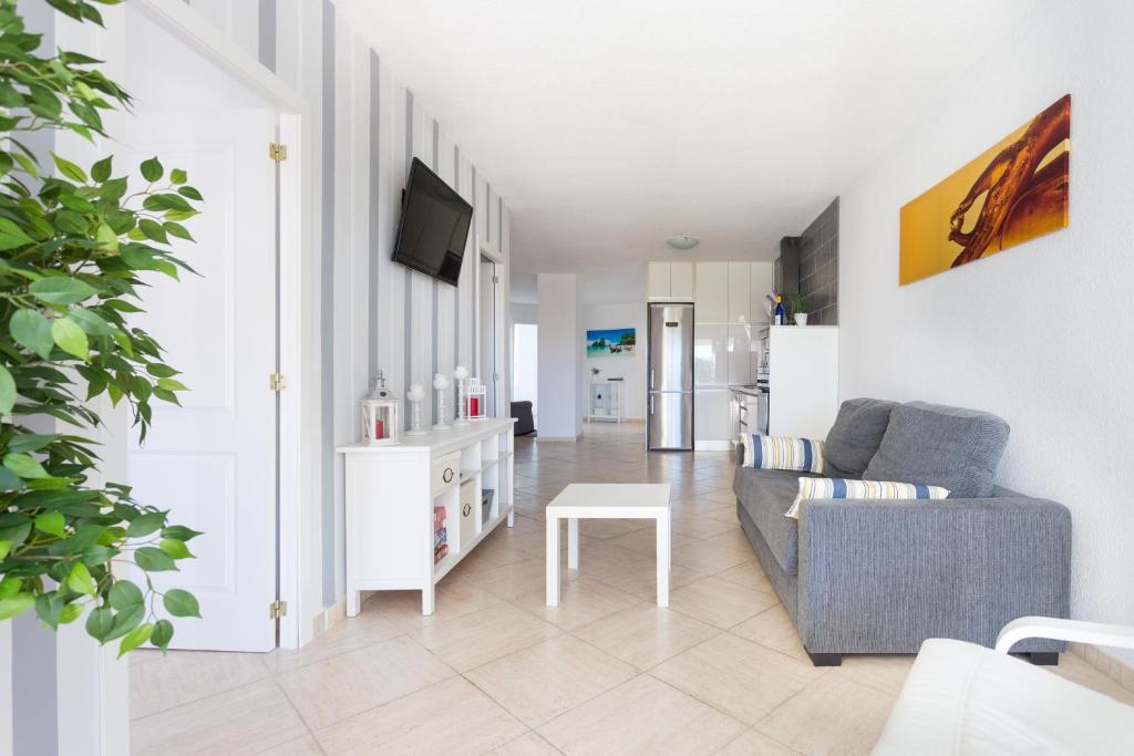 Televízia a/alebo spoločenská miestnosť v ubytovaní Primera línea de mar ! Fantástico apartamento