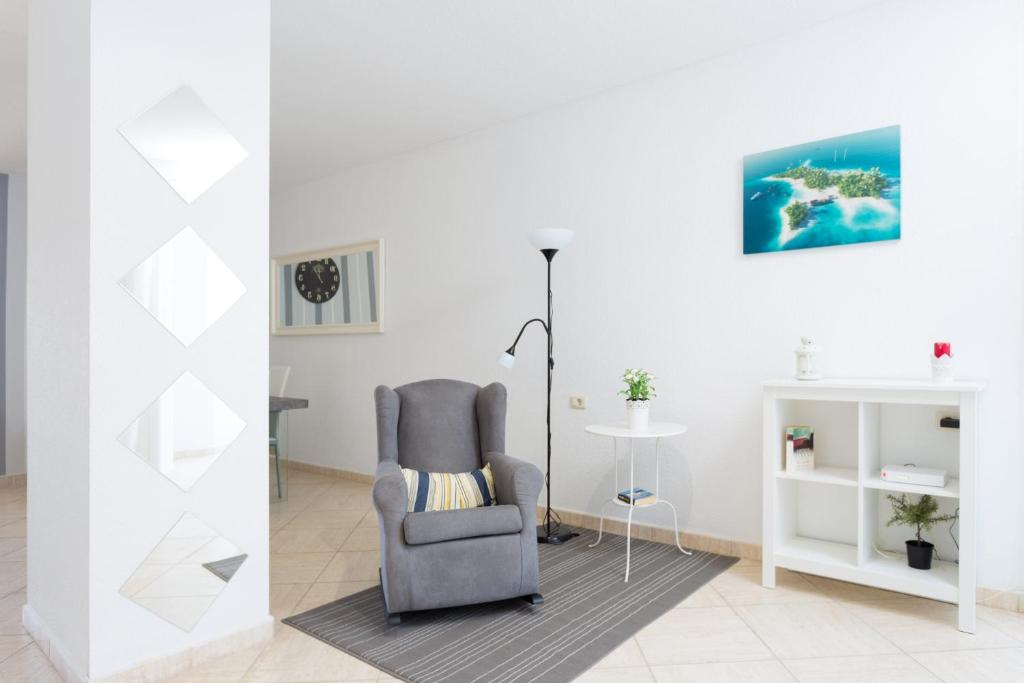 Posedenie v ubytovaní Primera línea de mar ! Fantástico apartamento