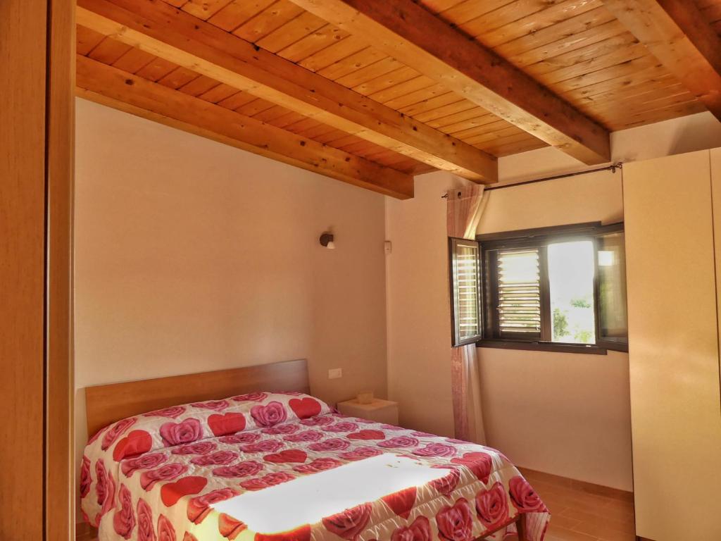 Postel nebo postele na pokoji v ubytování Gelsomino B&B