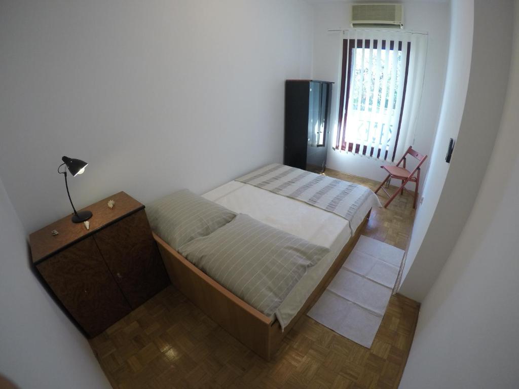 Un pat sau paturi într-o cameră la City apartment Amfora