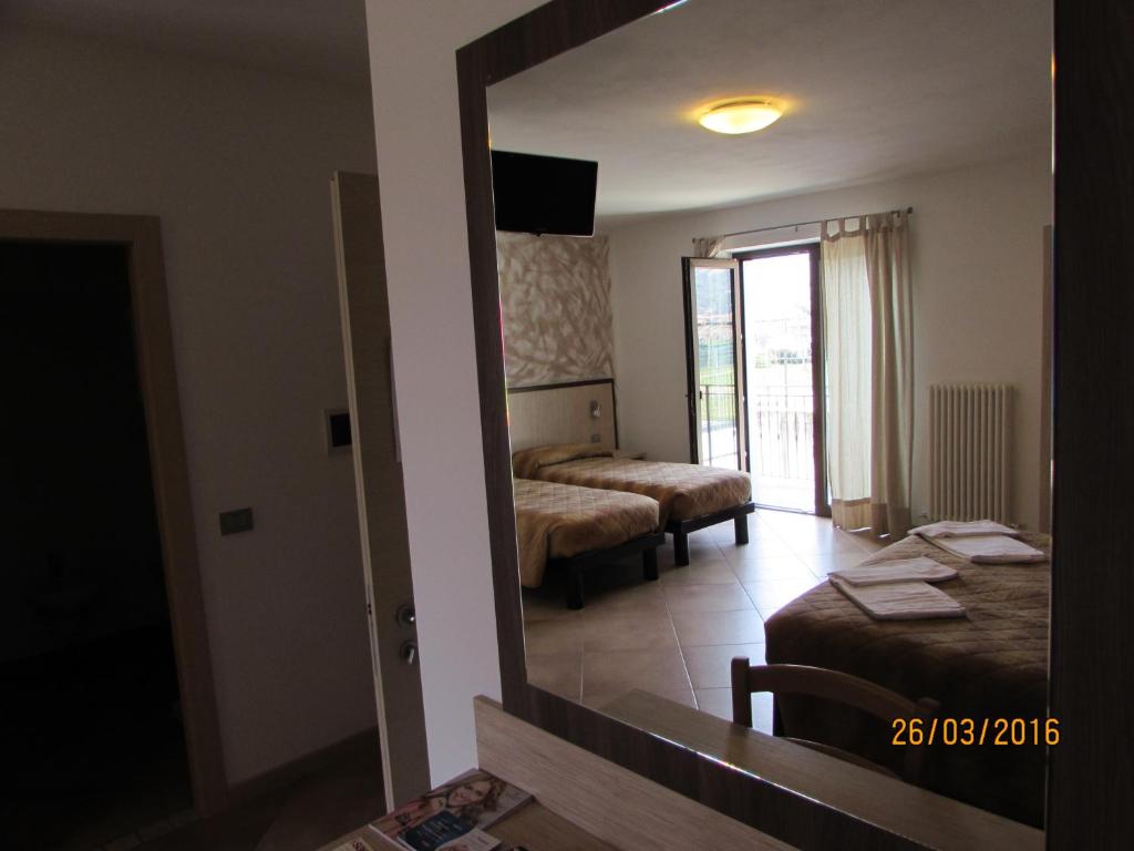 Postel nebo postele na pokoji v ubytování Agritur Arcosole B&B Camping
