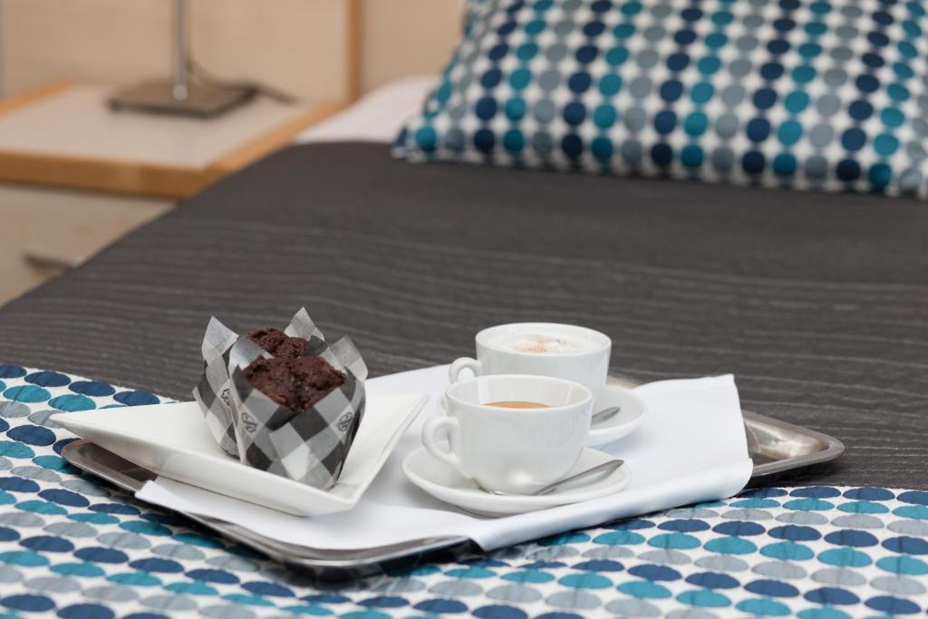 Posteľ alebo postele v izbe v ubytovaní Hotel Perła