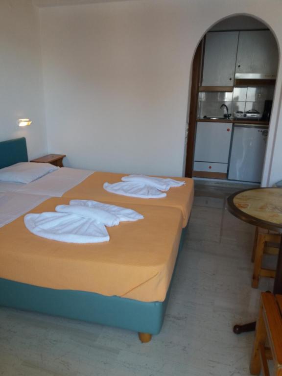 Postel nebo postele na pokoji v ubytování Hotel Anatoli Apartments