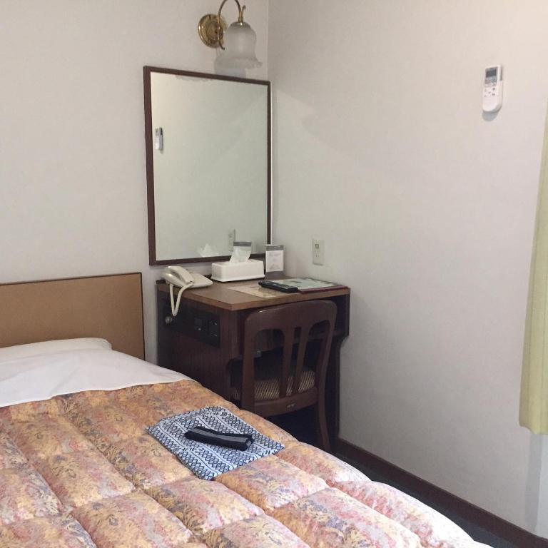 Postel nebo postele na pokoji v ubytování Oka Hotel