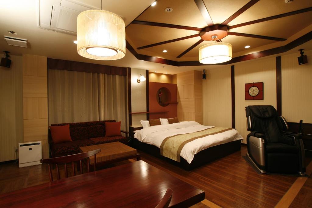 Postel nebo postele na pokoji v ubytování Hotel & Spa Lotus (Adult Only)