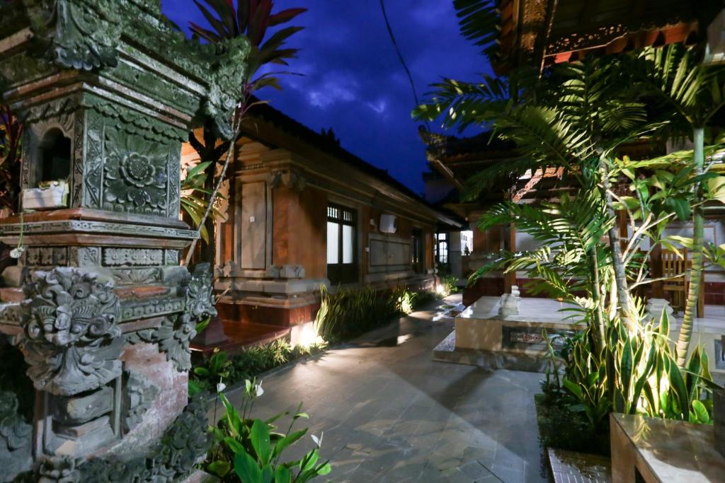 a courtyard of a house with trees and plants at The Jero Ubud in Ubud