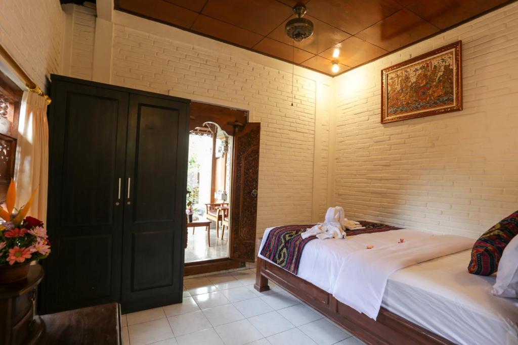 Postel nebo postele na pokoji v ubytování The Jero Ubud