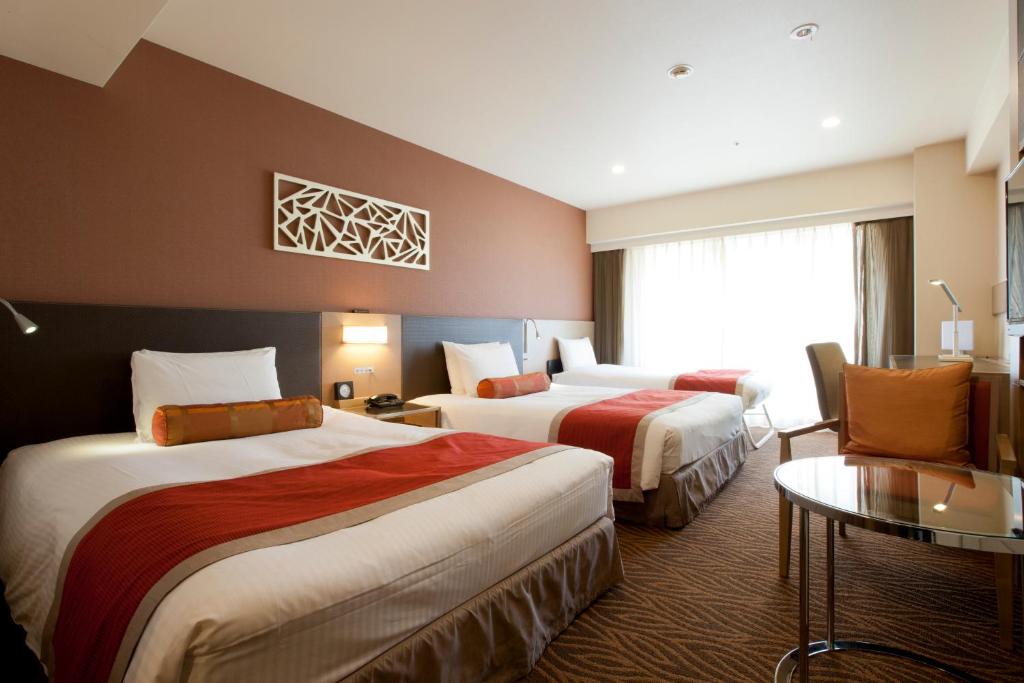Postel nebo postele na pokoji v ubytování Hotel Sardonyx Tokyo
