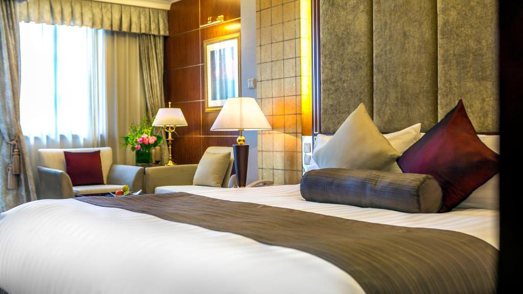 Postel nebo postele na pokoji v ubytování Xijiao State Guest Hotel