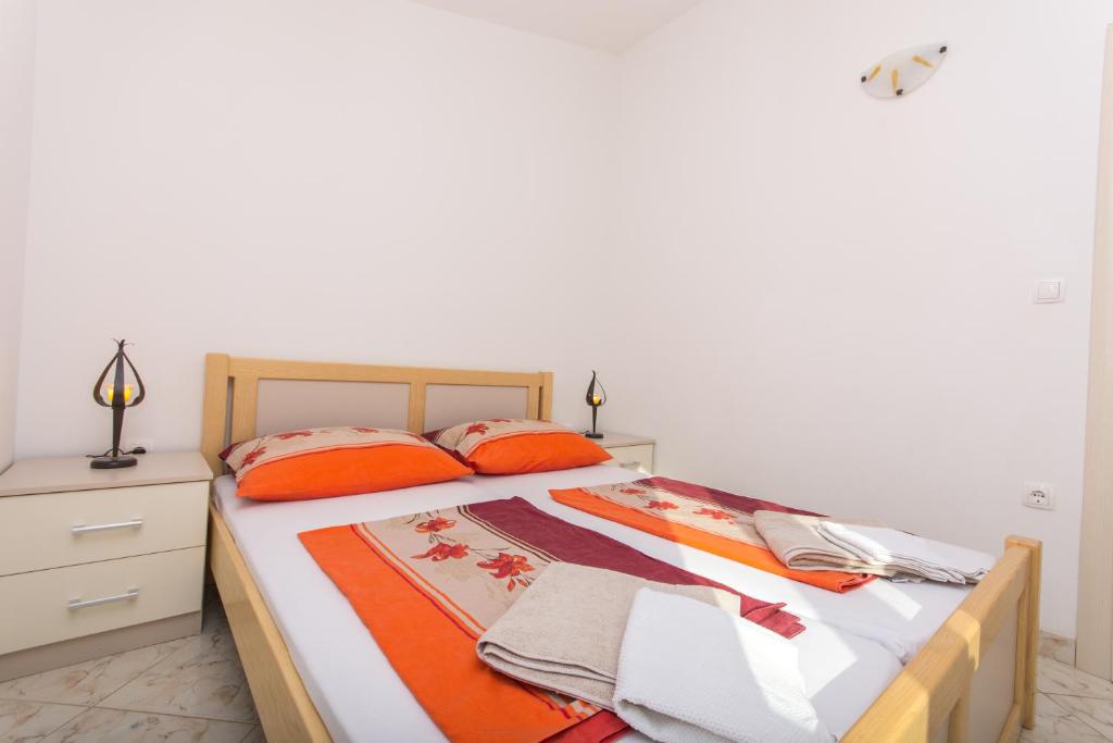 Posteľ alebo postele v izbe v ubytovaní Apartments Jaman Ivan