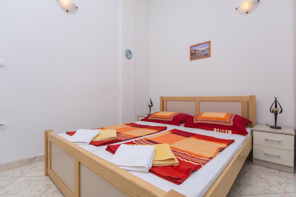 Posteľ alebo postele v izbe v ubytovaní Apartments Jaman Ivan