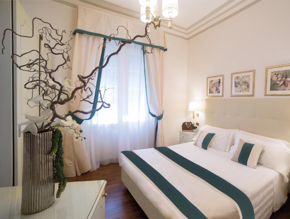Postel nebo postele na pokoji v ubytování Hotel Jolanda