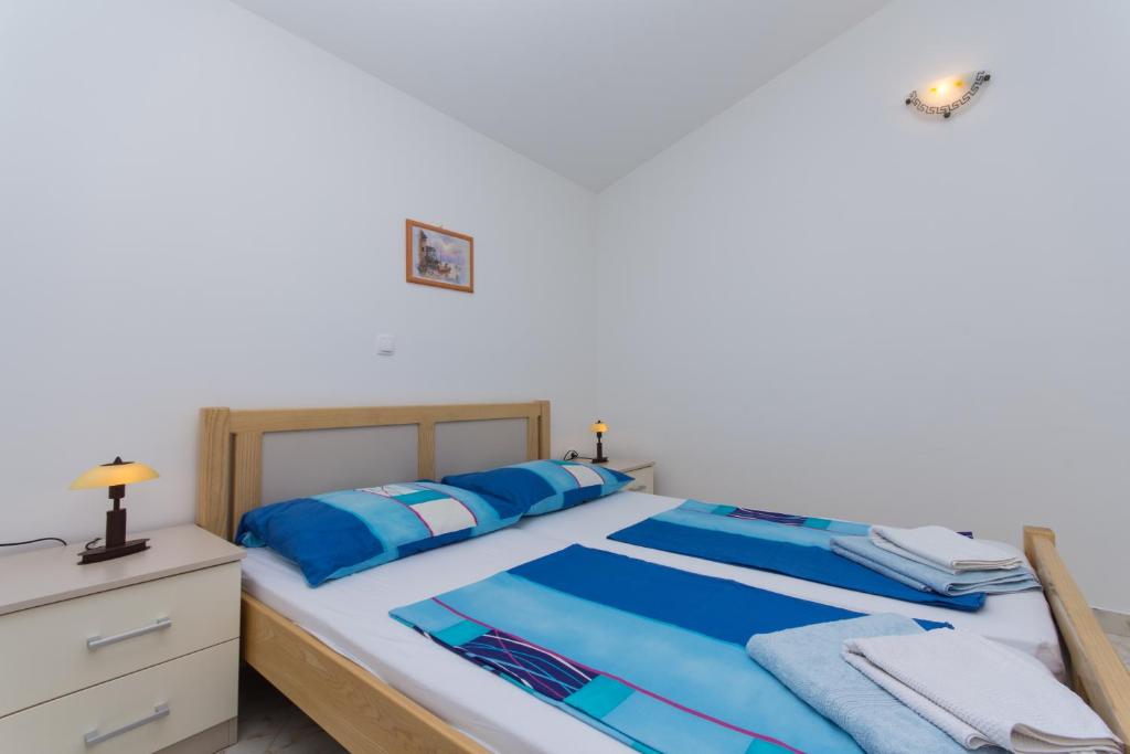 Posteľ alebo postele v izbe v ubytovaní Apartments Jaman Ivan