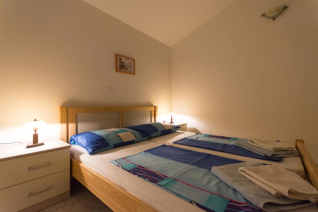 Posteľ alebo postele v izbe v ubytovaní Apartments Jaman Ivan