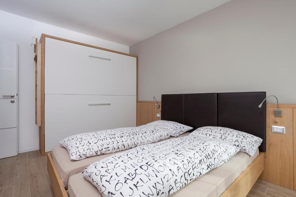 Postel nebo postele na pokoji v ubytování Appartamento Mirabell
