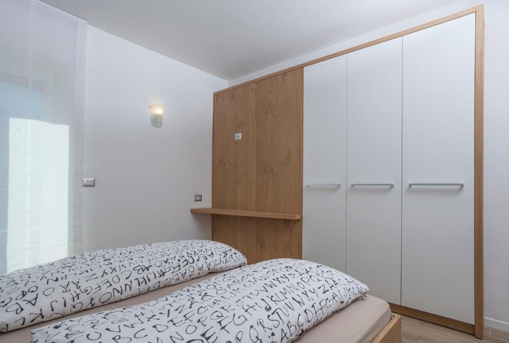 Postel nebo postele na pokoji v ubytování Appartamento Mirabell