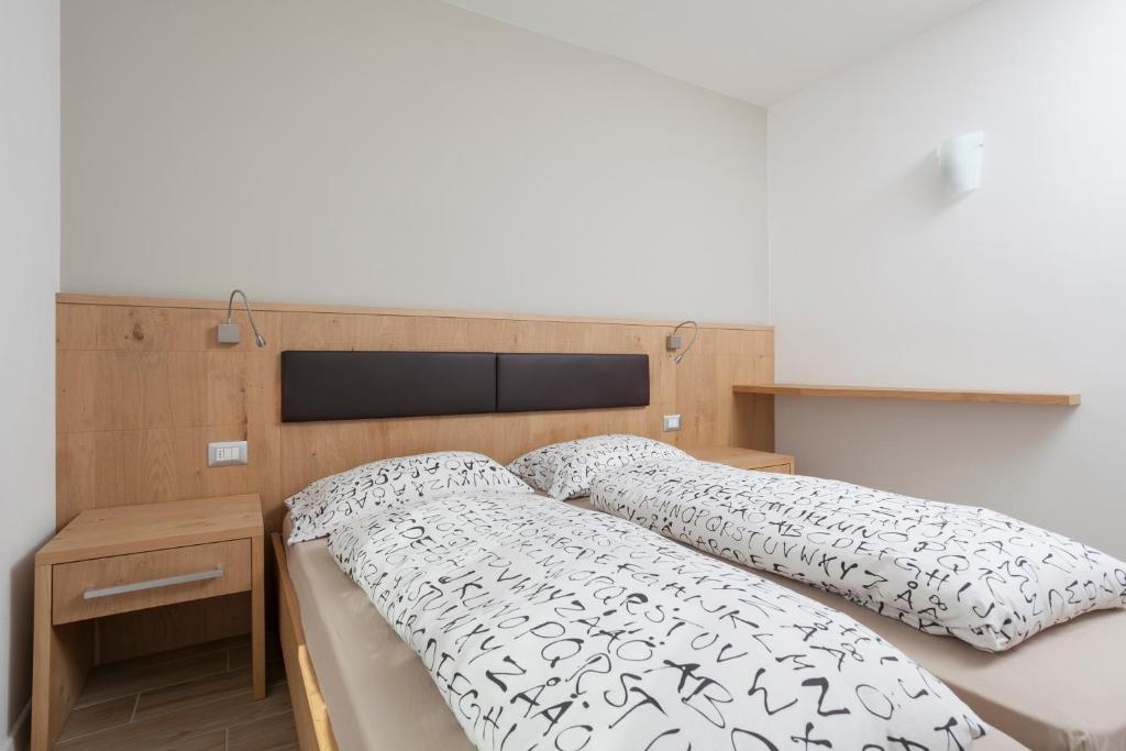 Postel nebo postele na pokoji v ubytování Appartamento Mirabell