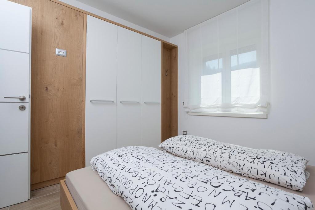 Postel nebo postele na pokoji v ubytování Appartamento Mirabell
