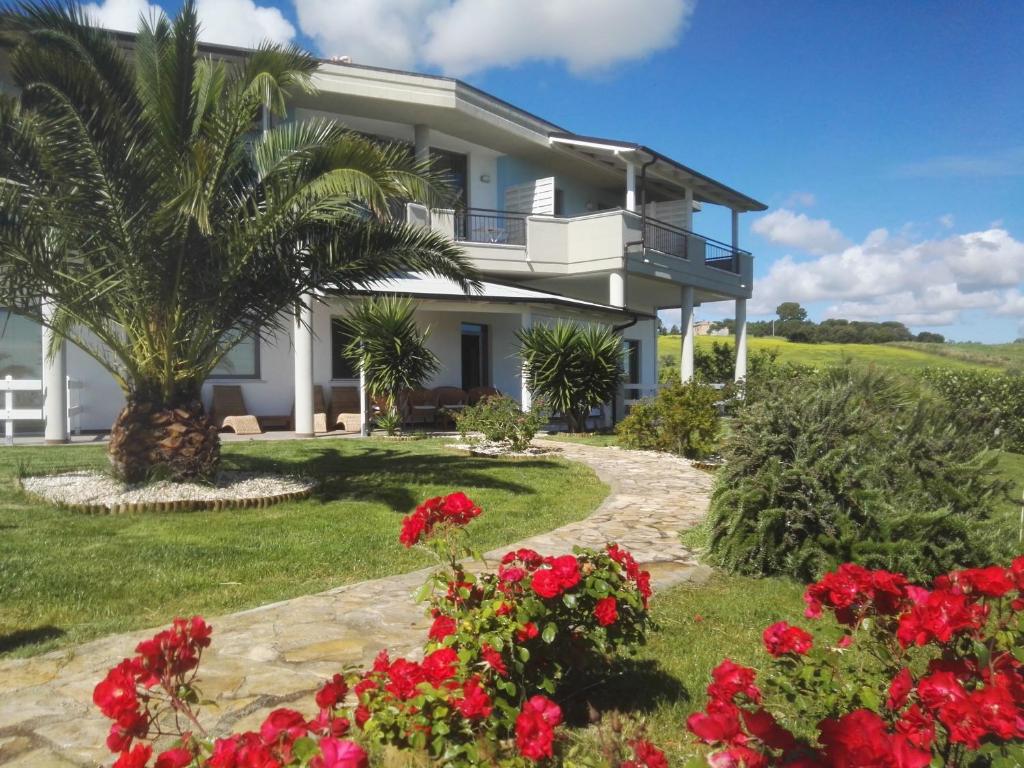 a house with flowers in front of it at Colle Selvotta in Vasto