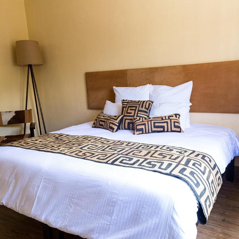 Postel nebo postele na pokoji v ubytování Acacia Tree Lodge