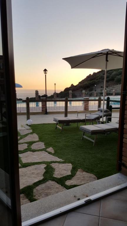 Dolce Risveglio a Nebida - Incantevole Casa con Vista Mare