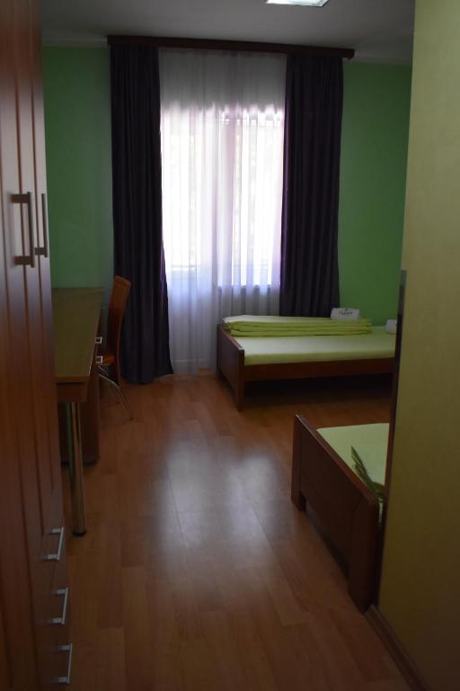 Postel nebo postele na pokoji v ubytování Clinic for Rehabilitation Vujan