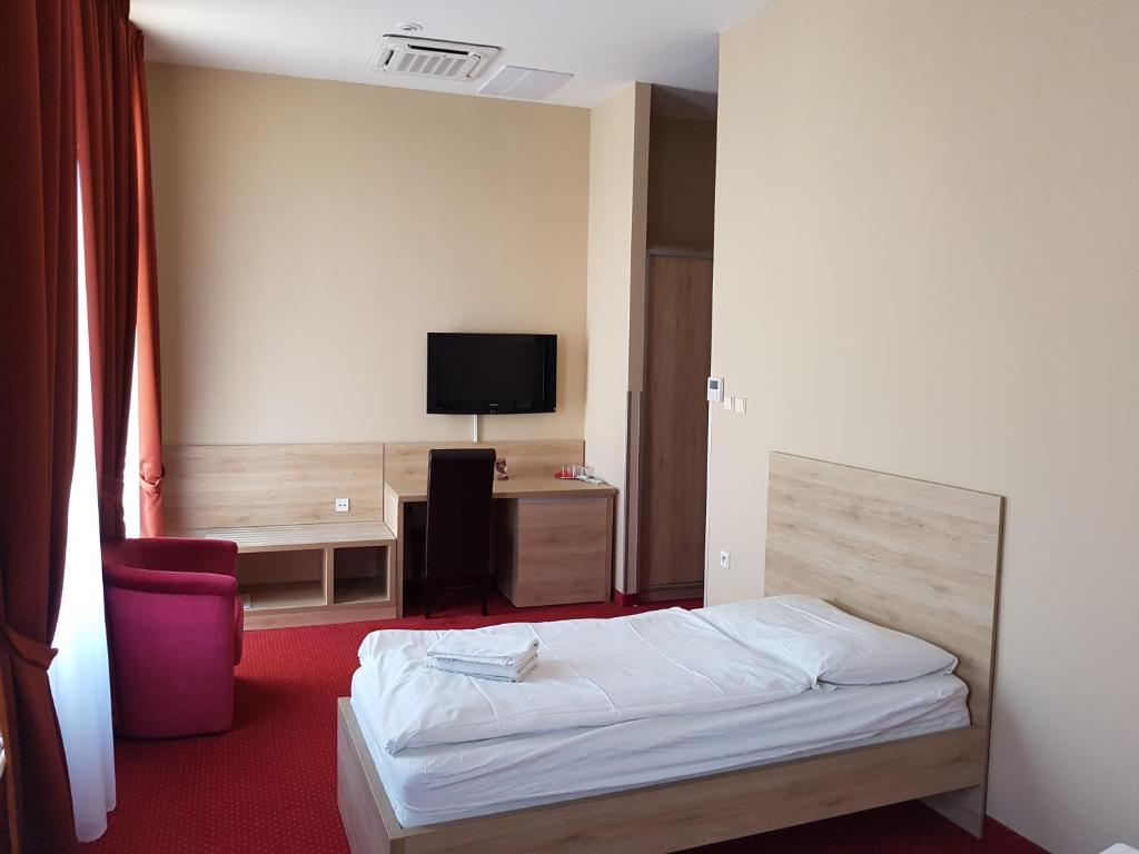 Televízia a/alebo spoločenská miestnosť v ubytovaní Hotel Stardust