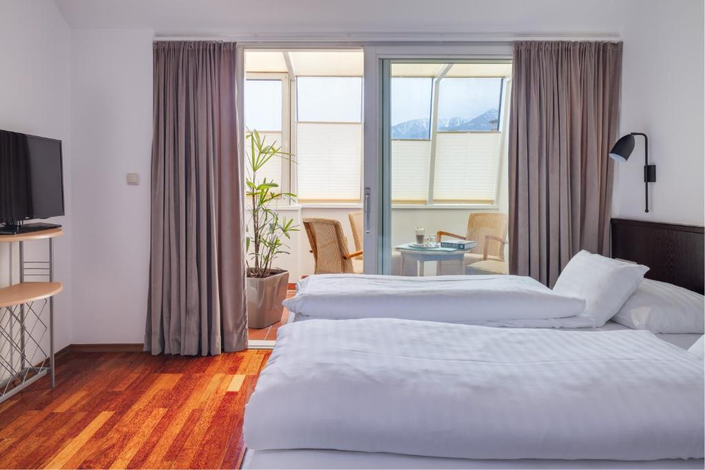 Postel nebo postele na pokoji v ubytování Hotel Central