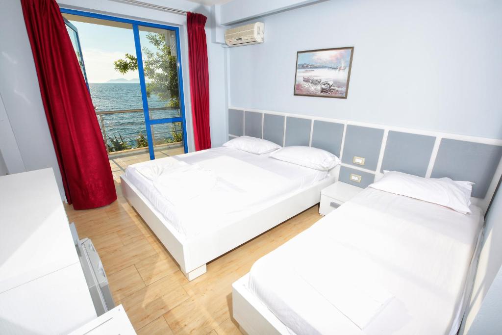 Postel nebo postele na pokoji v ubytování Hotel Nimfa