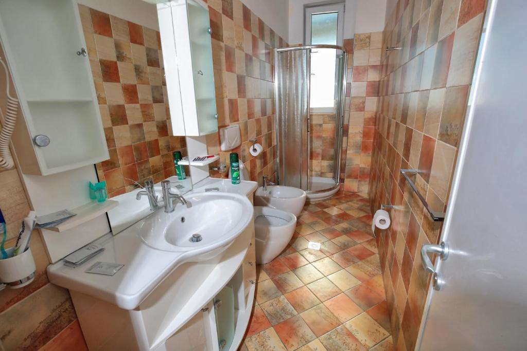 Koupelna v ubytování Hotel Nimfa