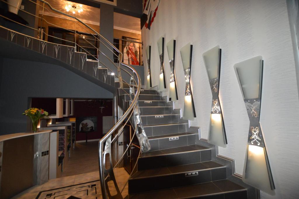 a staircase in a building with lights on the wall at Kiwara Guesthouse in Johannesburg